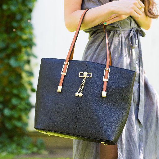 The PortoVino is a beautiful new fashion handbag that has the added benefit of allowing you to carry and pour up to 2 bottles of wine or any beverage on the go!