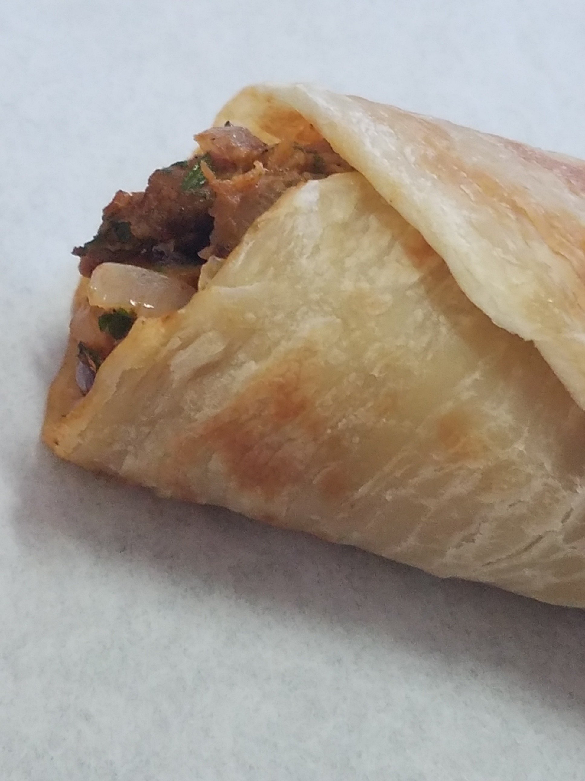 Calcutta Kathi Rolls/ Wraps/ Indian Burrito. Chicken seasoned with Indian spices, drizzled with hot and tangy chili sauce wrapped in a flaky flat Indian bread.