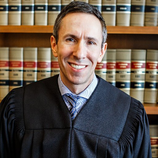 Judge Keenan was raised on public assistance, arrested in his youth, and dropped out of high school. He uses his background to work for access to justice.