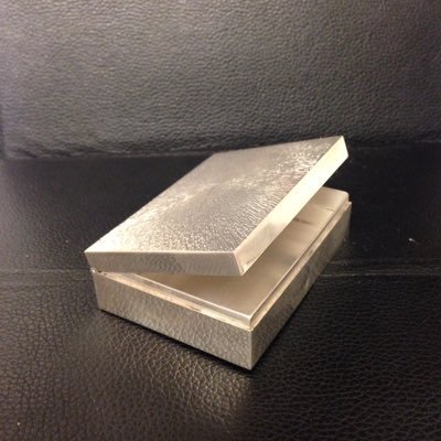 Designer maker of metal things to give away.