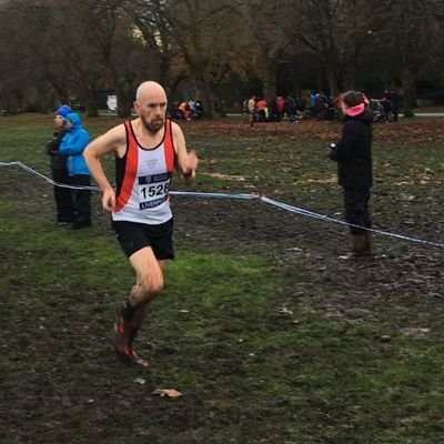 Bald, old geezer trying to keep up with whipper snappers as he runs. Club secretary for St Helens Sutton AC