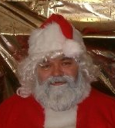 A Jolly Ol' Elf praying for the world to keep the Spirit and Joy of Christmas throughout the year