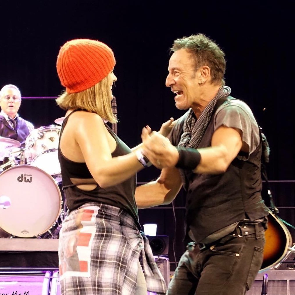 wife. mother. springsteen tramp wearing the red hat.