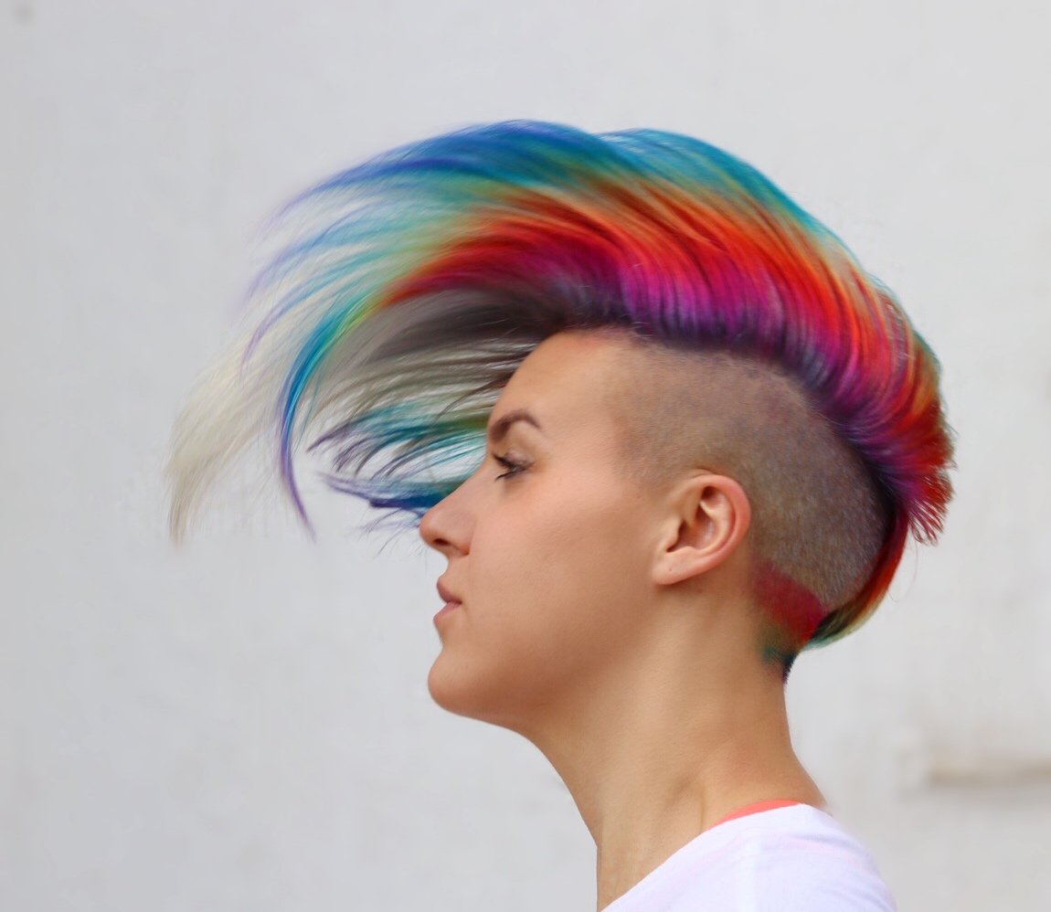 I'm tall and short, with rainbow'd hair. You may know me for my inventions, which include solids, crows, and the new way of eating mashed potatoes.
