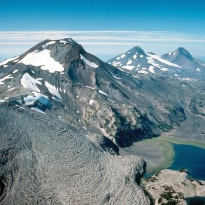 Cluster of 3 sassy stratovolcanoes in central Oregon with 3 very different personalities. Known to be heavy breathers. Part of a local gang of 450 volcanoes.