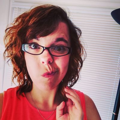 nerdyalerty's profile picture. the girl with a flashing neon sign above her head blinking nerd alert (she/her)
