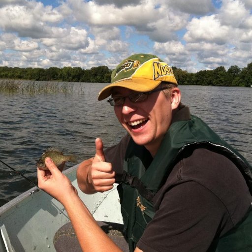 Yep, that's me holding a tiny sunfish. Catch a bunch of those and you've got yourself a bag of sun chips.