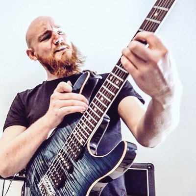 Ex-guitarist for Under a Banner, backing vocals, composer, teacher