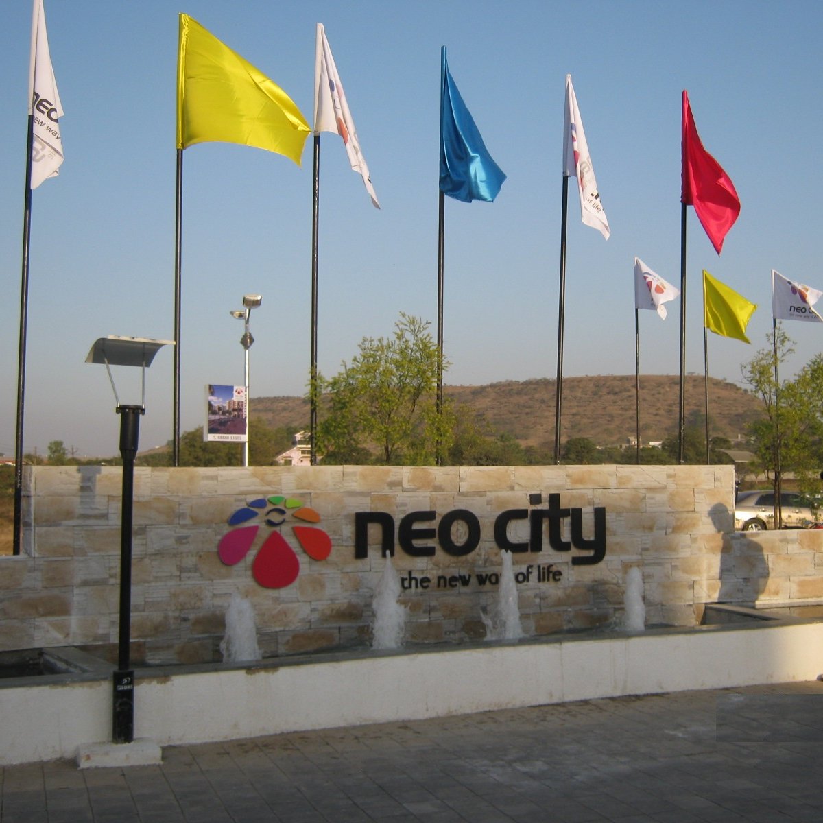 Neo City (@neocitywagholi) is a residential complex in Wagholi, Pune with over 500 units.