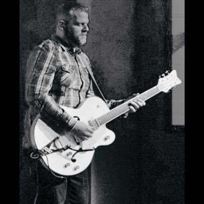 Redeemed husband, father and string-changer.
