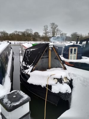 Young family living on a narrowboat getting away from it all.