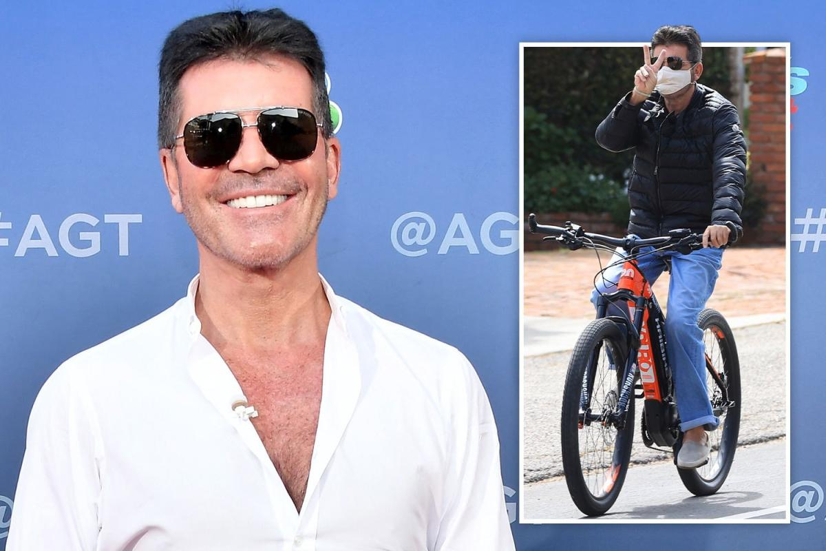 Simon Cowell in hospital after 'breaking his back' in a bike accident