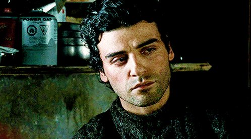 “Oscar Isaac looking pensive in his cable-knit jumper in The Bourne Legacy....