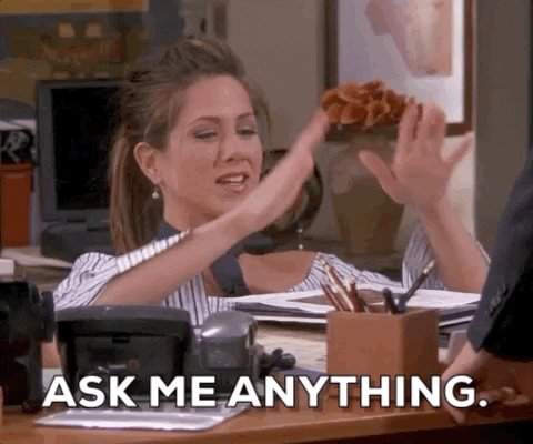 Jennifer Aniston sitting at a desk saying "Ask me anyth