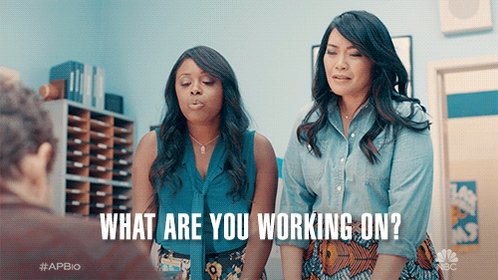 a Black woman says, "What are you working on?" A w