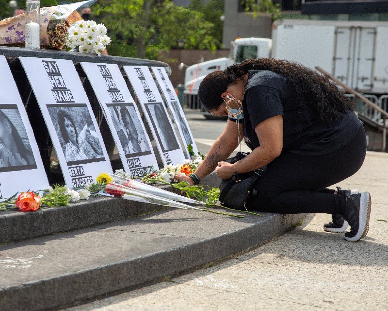 Gif of a person of color kneeling in front of an altar of ph