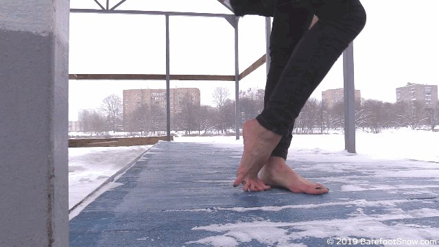 “Beautiful Anna's chilly flexible feet in the snow on a very frosty...