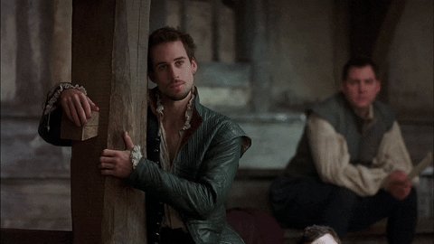 GIF: Joseph Fiennes hugs a theatre pillar in Shakespeare in Love.