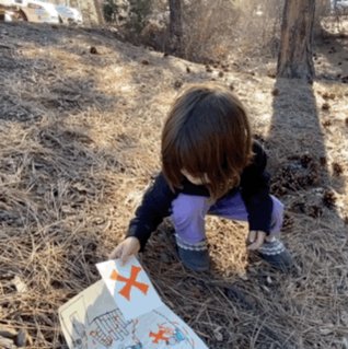 toddler looks at the map, looks up in disbelief, fans herself and says “ohhhh”