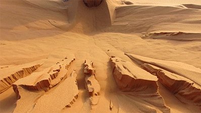 Person digging at sands only for more to continuously flow in and fill the hole