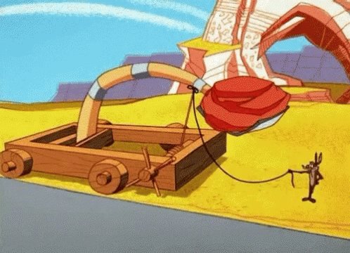 Wile E Coyote with a giant rock on a catapult. When he relea