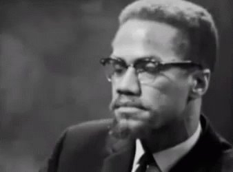 Malcolm Smile GIF