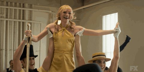 happy musical theatre GIF b...