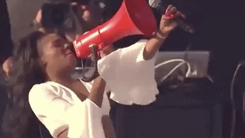 woman yelling into a bullhorn