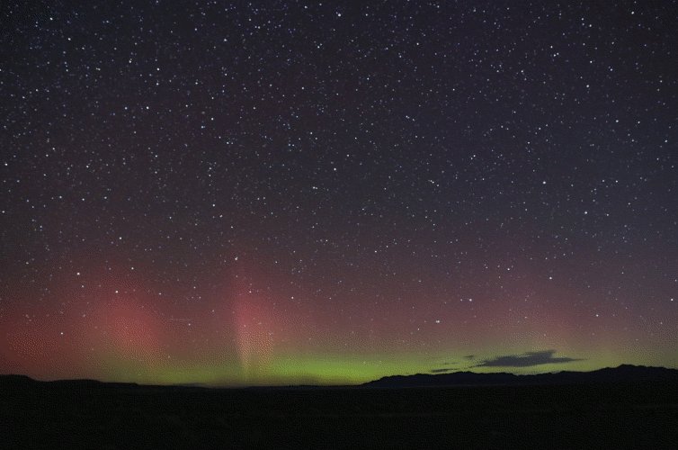 time-lapse of colorful aurorae flickering in a starry sky