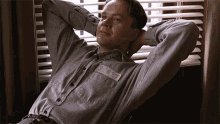 Relaxing Andy Dufresne GIF