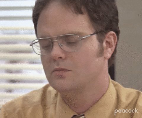 Zoom in shot of a quietly angry Dwight from The Office.
