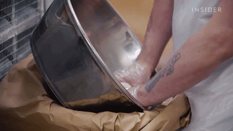 GIF; a baker kneads dough with a lot of force.