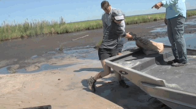 Gif of volunteers bringing sandbags to the New Orleans coast