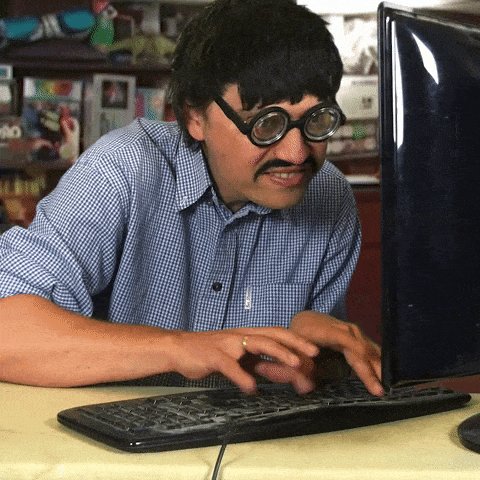 Man with comedy glasses hacking at a computer