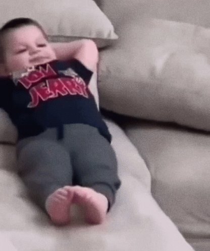 Lil Kid Chilling Chilling On Couch GIF