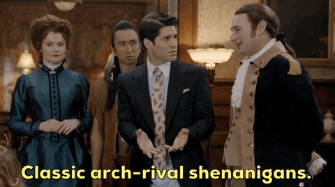 Three men and one woman are dressed in an assortment of peri