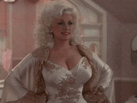 Gif of Dolly Parton smiling